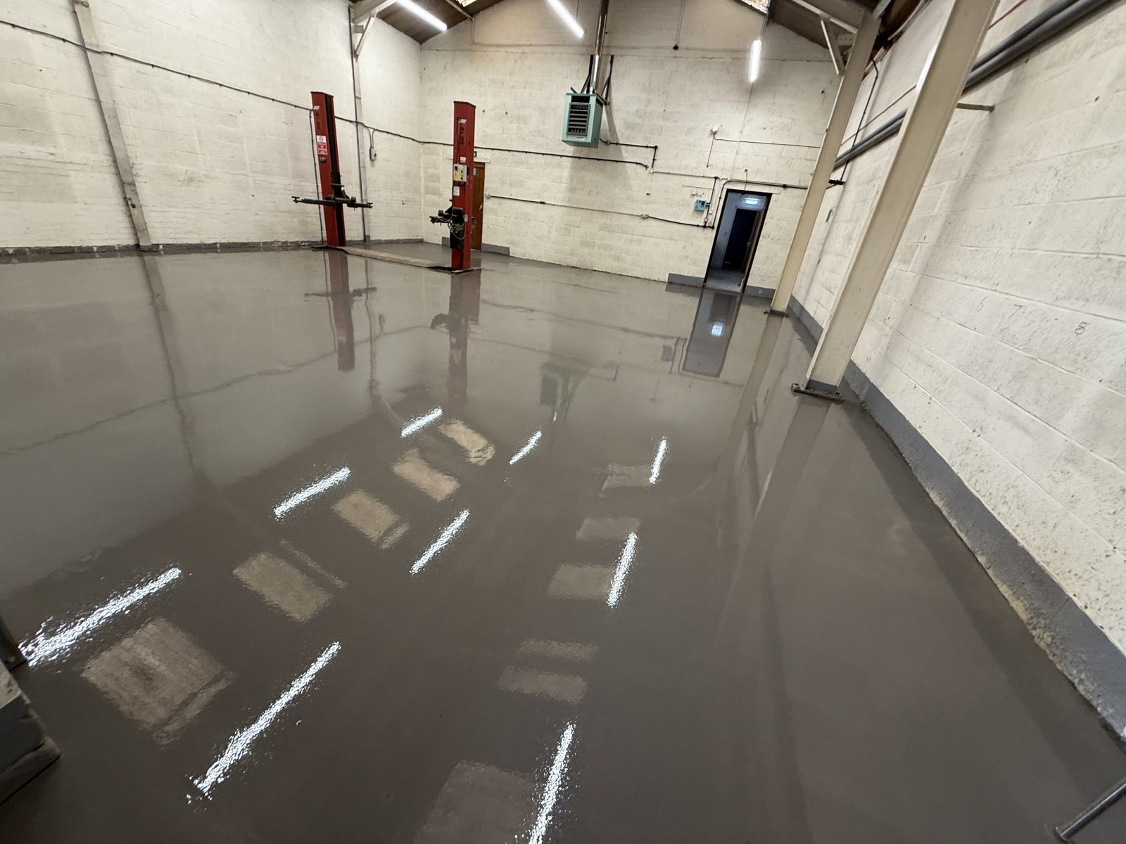 Industrial and warehouse flooring — heavy-duty sheet vinyl and safety flooring installed in a UK distribution centre