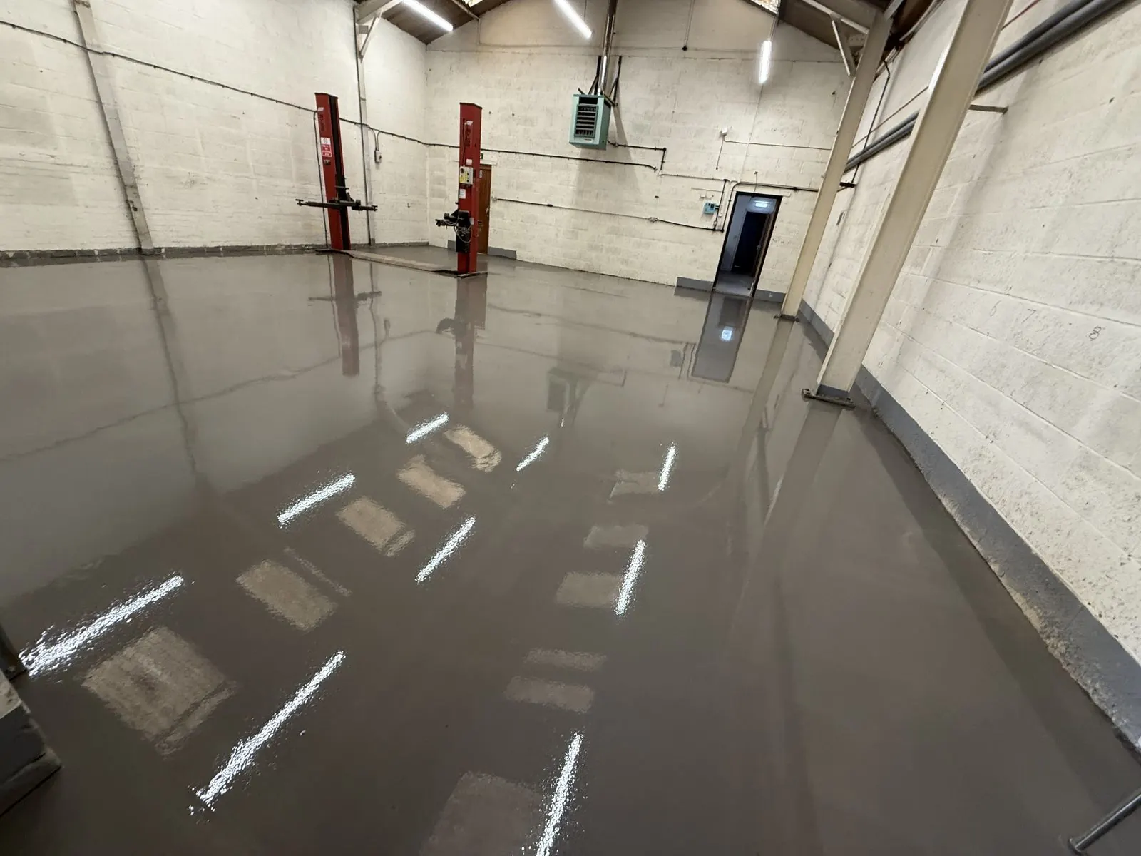 Industrial and warehouse flooring — heavy-duty sheet vinyl and safety flooring installed in a UK distribution centre